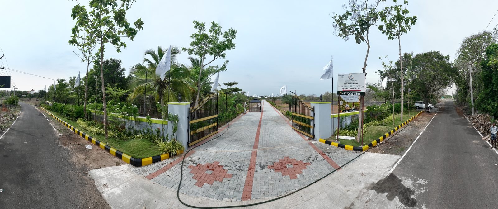 Gated entry and internal road at Mannvaasam Farms, Poonthandalam ECR